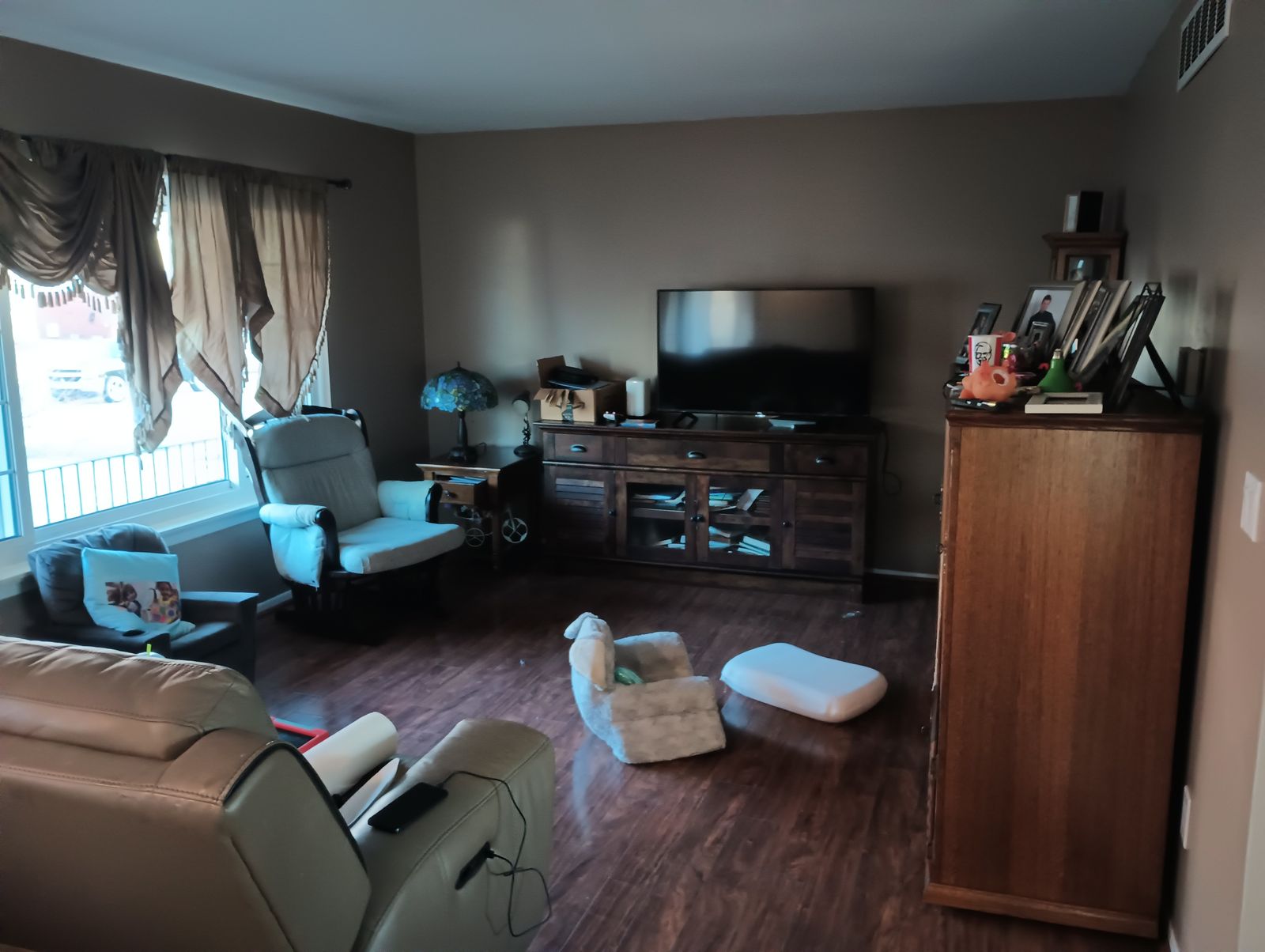 Living room after repaint, warm brown walls, finished
