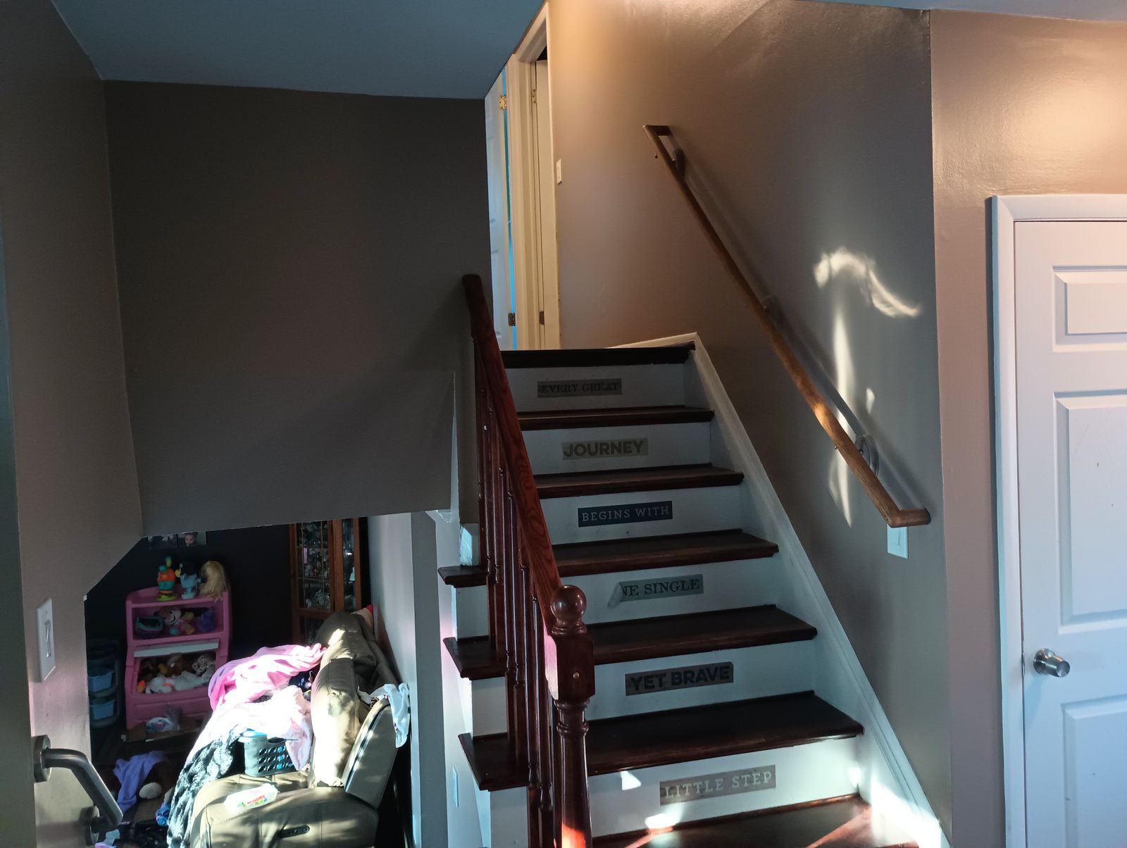 Stairway after repaint, wide angle, warm brown walls