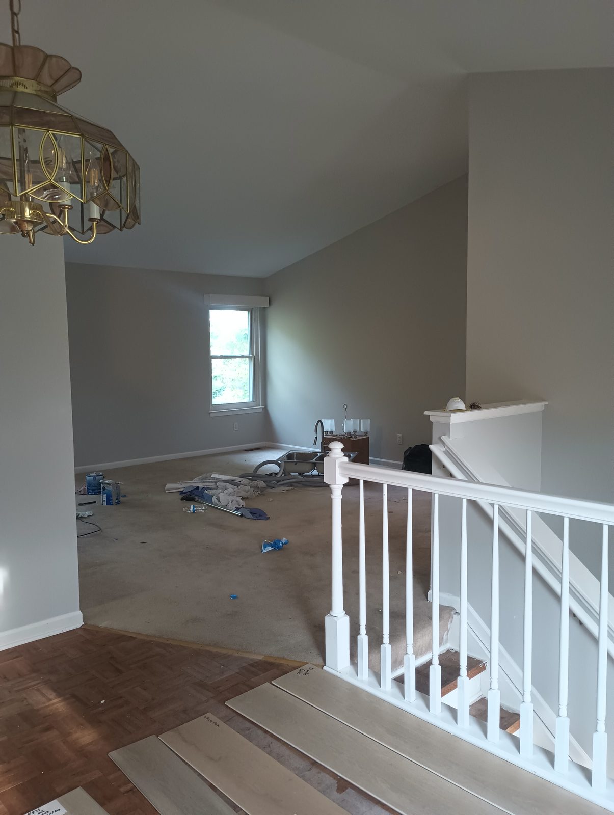 Same landing after, gray walls and white painted railing